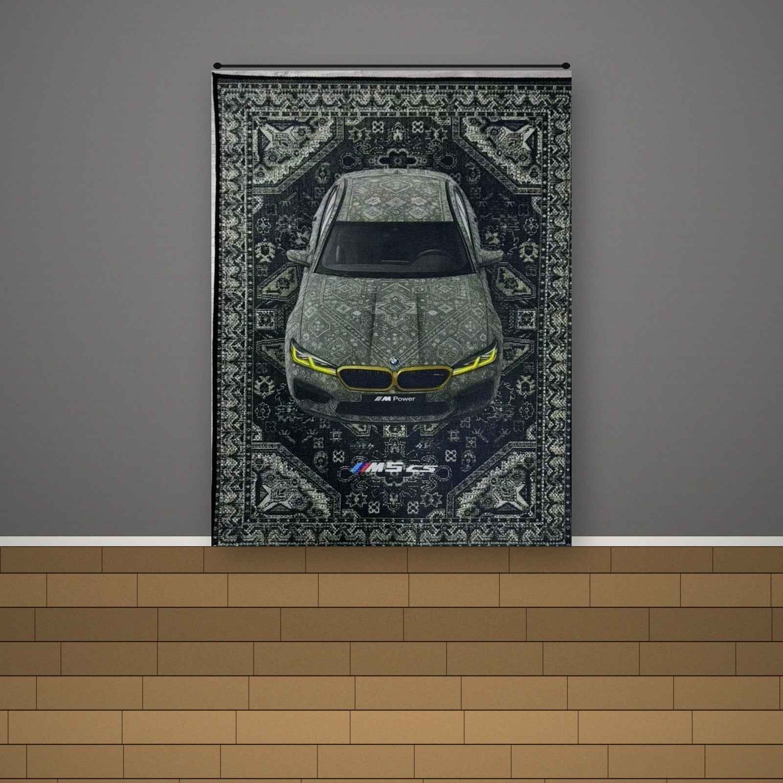 BMW M5 CS tapestry rug hanging on a warm gray accent wall with light oak flooring