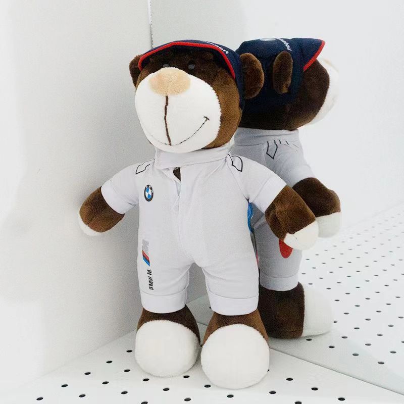 Two BMW M technician bear dolls side by side in white racing suits