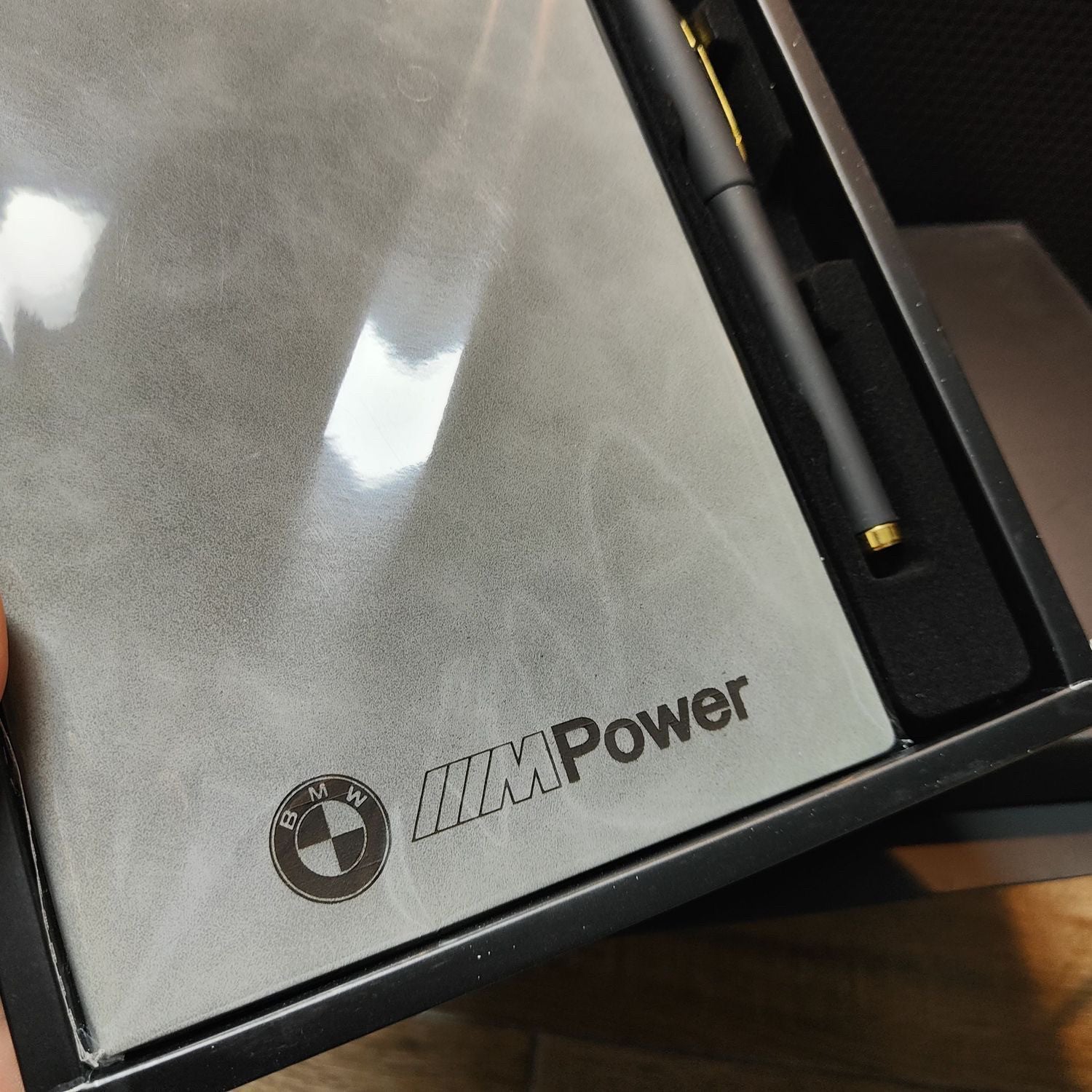 BMW M Power notebook and pen set close-up showing leather texture
