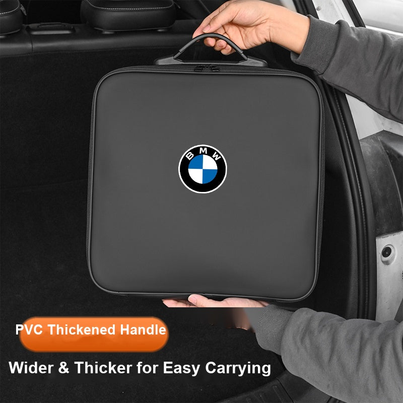 BMW charging cable storage bag being held by hand