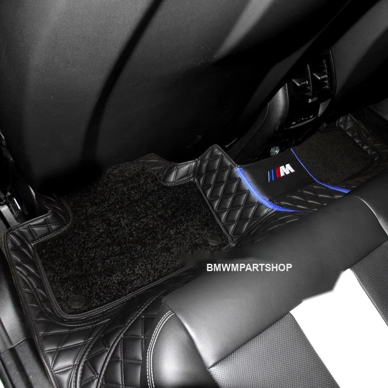 BMW custom floor mat installed in car with M badge detail