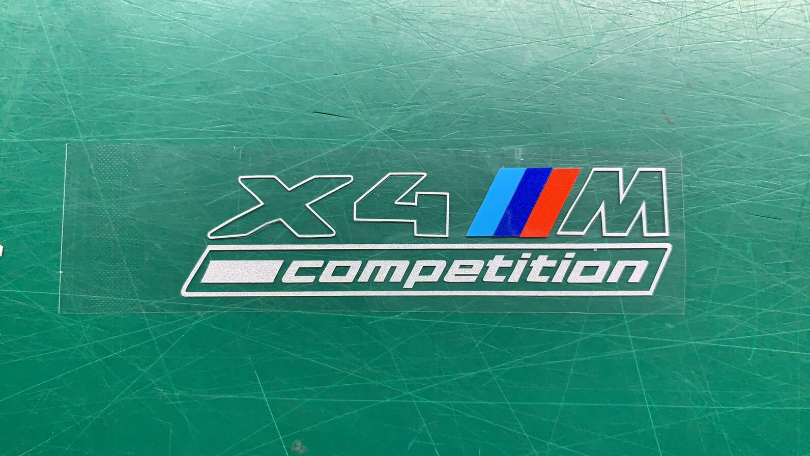 BMW X4M Competition center console badge sticker decal close-up