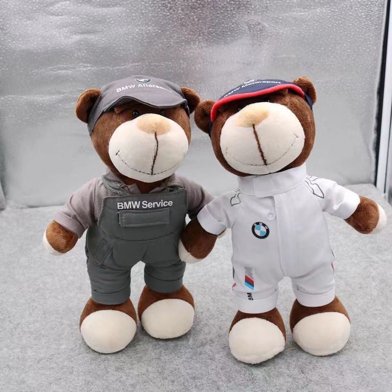 Two BMW technician bear dolls in white and grey uniforms