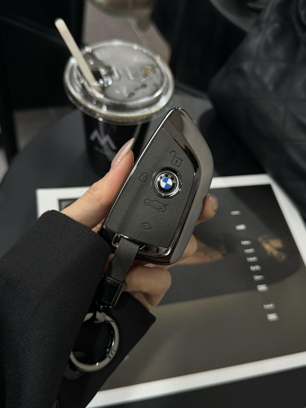BMW G-Series smart key case in Gunmetal Chrome held in hand