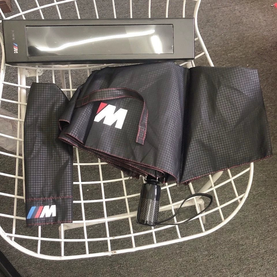 BMW M folding umbrella canopy detail with tricolor M stripe