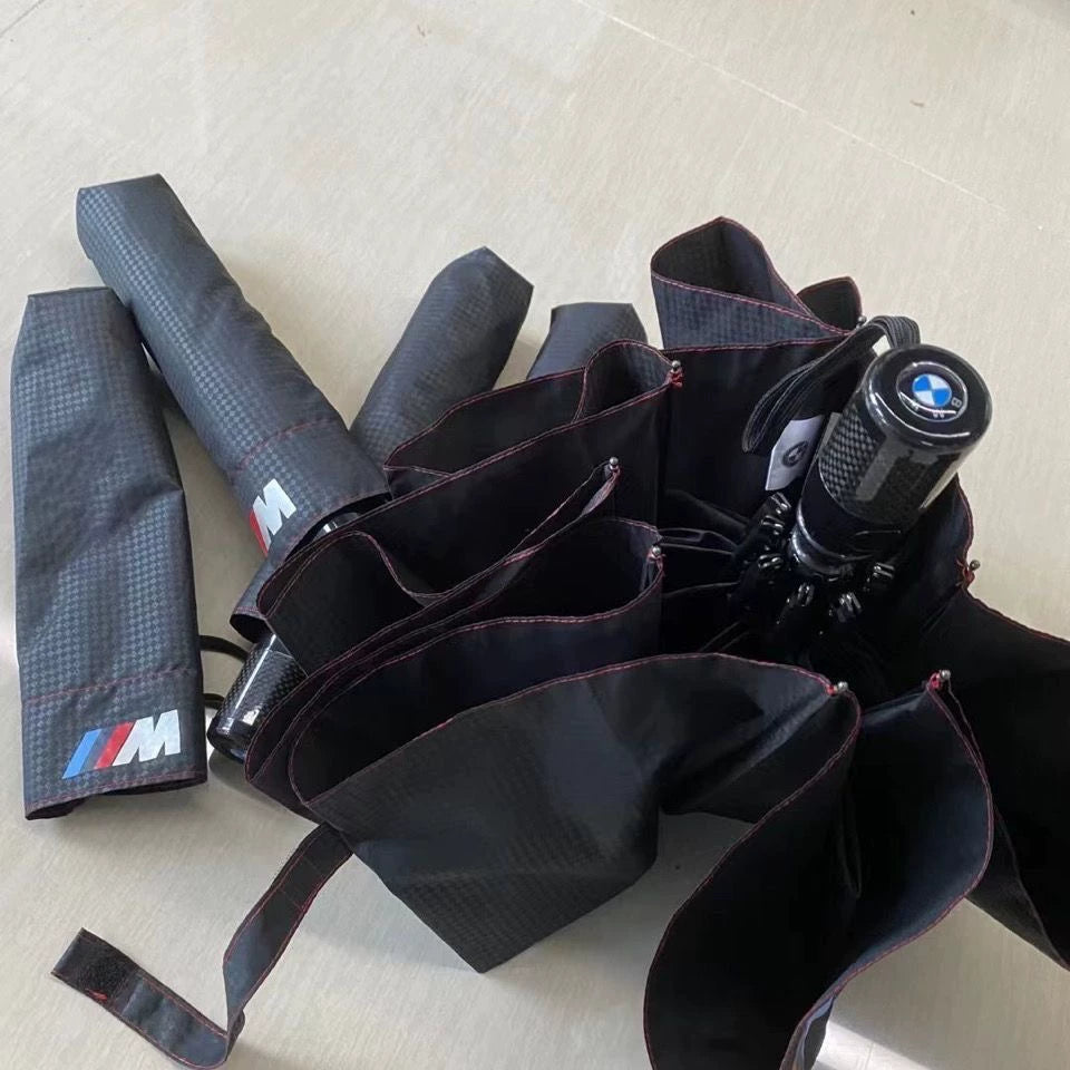 BMW M automatic folding umbrella open ribs close-up with BMW M logo on handle