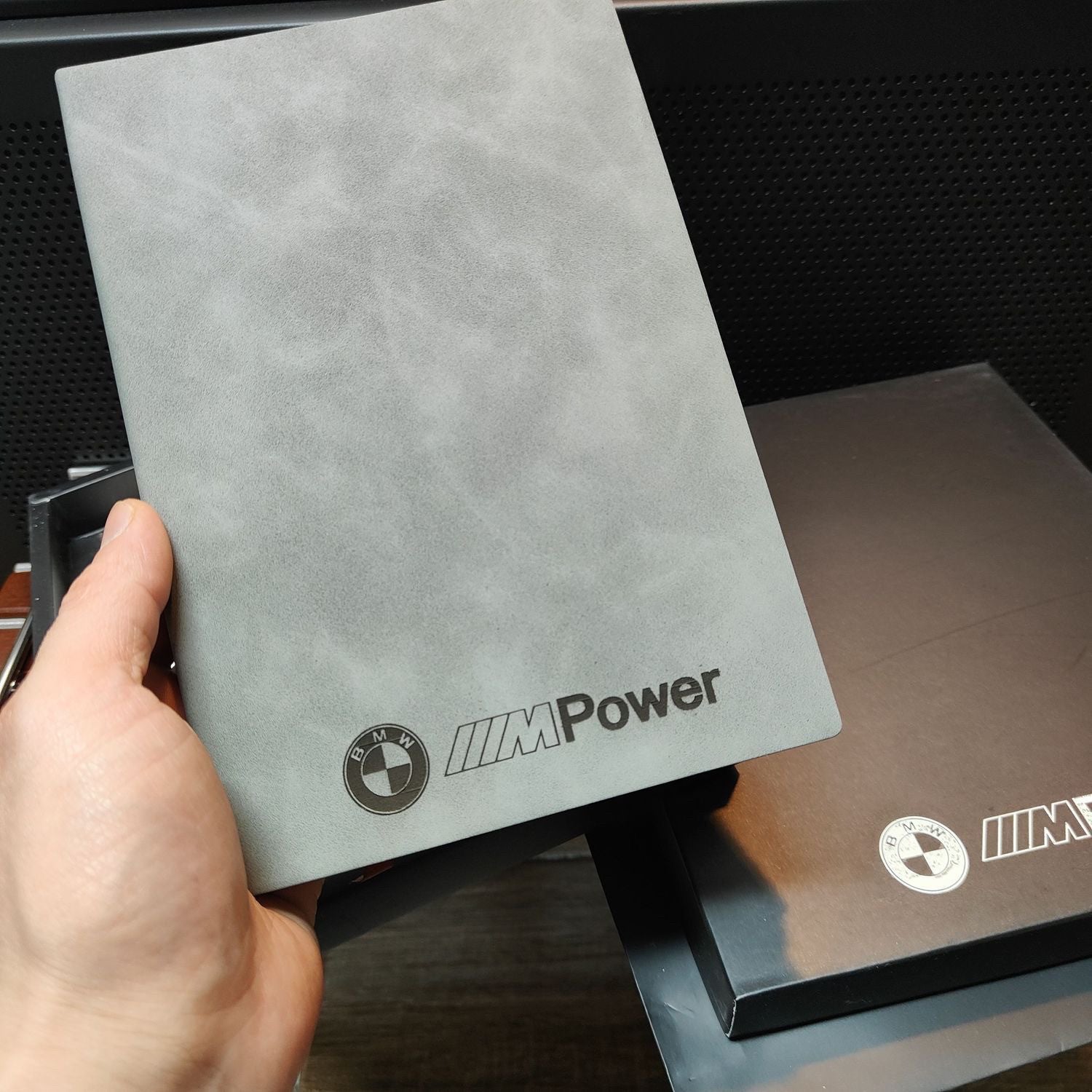 BMW M Power leather-look notebook cover held in hand