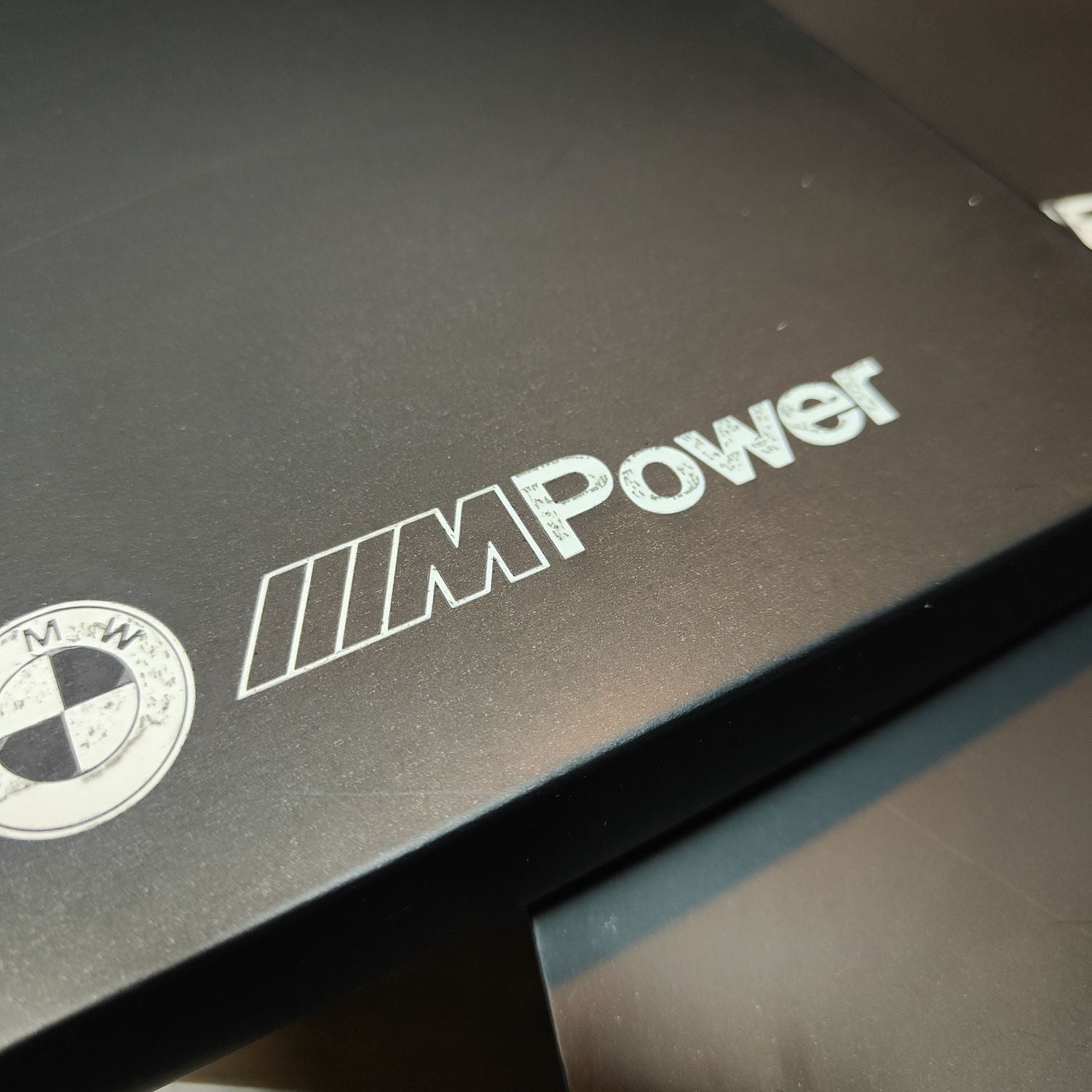 BMW M Power gift box lid close-up with embossed logo