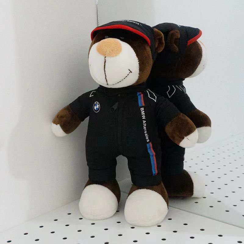 Two BMW technician bear dolls in white racing suits