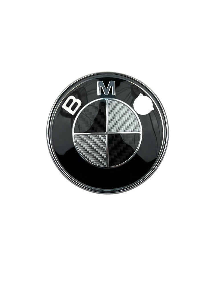 BMW black and white carbon fiber emblem badge on white background