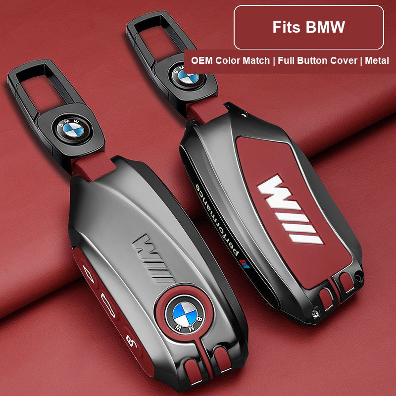Close-up of BMW key fob case with leather keychain and BMW logo buckle