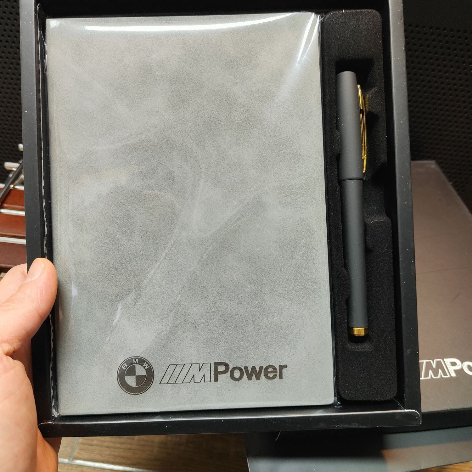 BMW M Power notebook and matching pen in gift box, held in hand