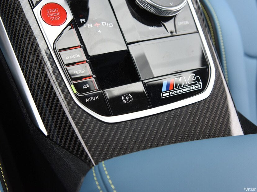 BMW M4 Competition center console badge sticker installed in car interior