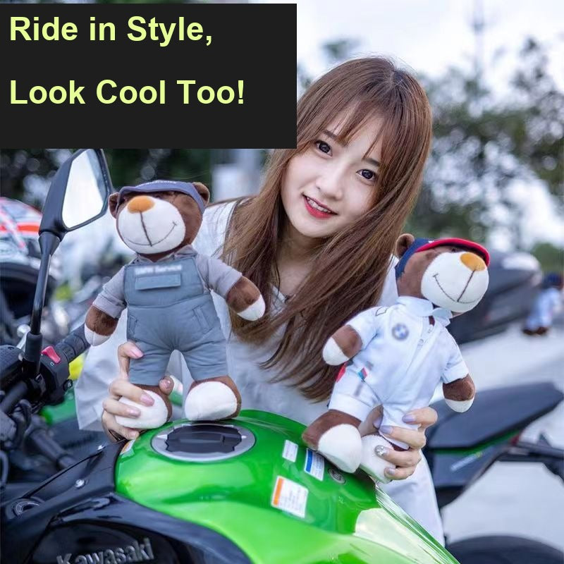 Woman holding two BMW technician bear dolls on a motorcycle