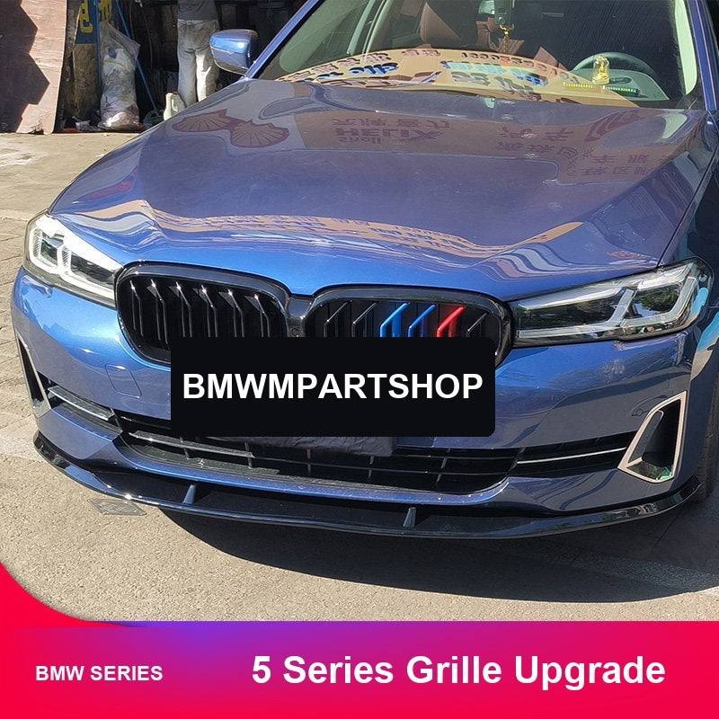 BMW 5 Series grille kit on blue sedan