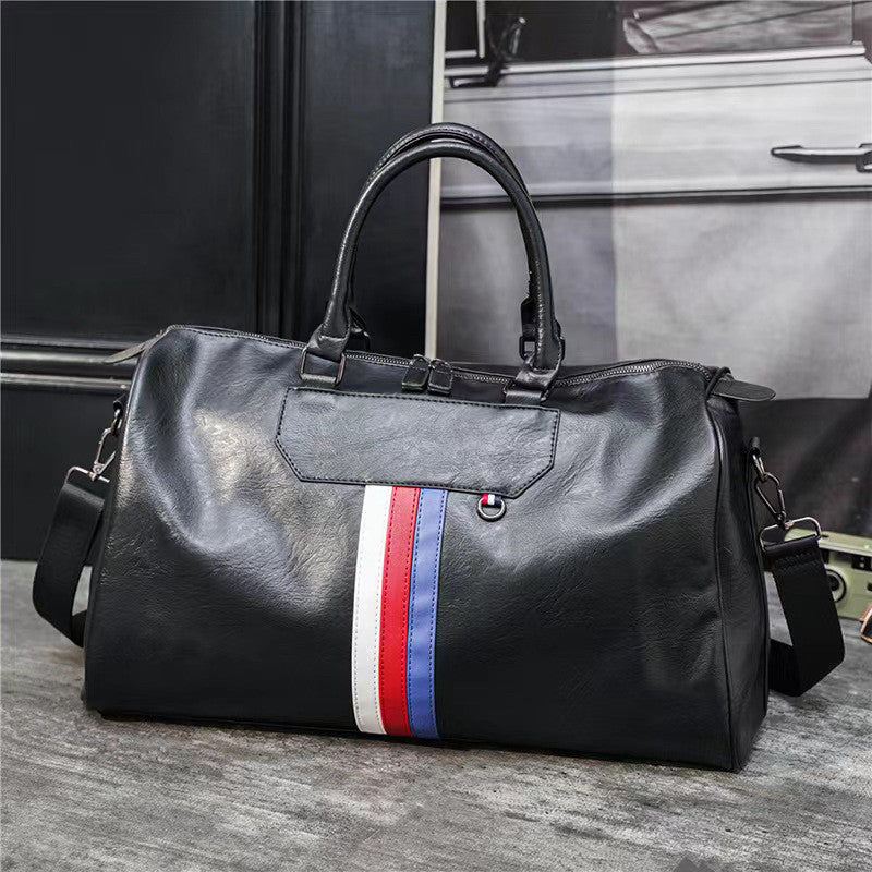 BMW duffel bag on textured background showing crossbody strap