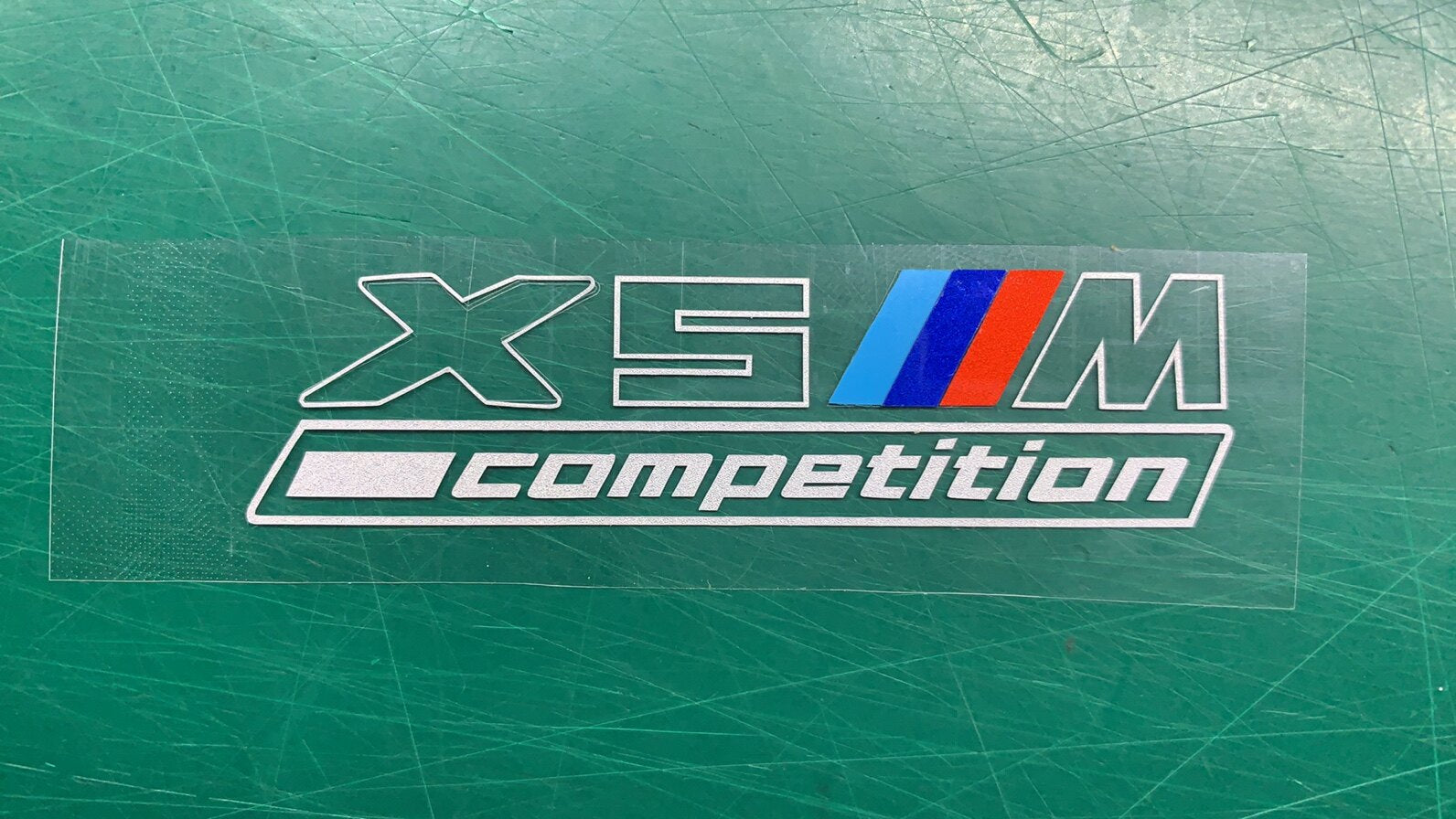 BMW X5M Competition center console badge sticker decal close-up